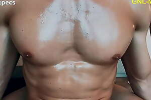 Enjoying a hot oil massage to his hot pecs and pointy nipples!