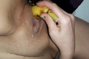 Redhead slut squirts all over a banana (first time)