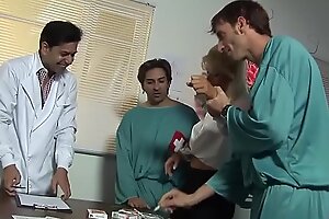 Cum-hungry Kathy gets three doctors in her mouth on the couch 