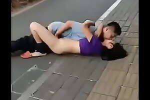 A couple doing sex on street