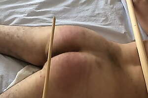 caned cuffed to poles - no escape